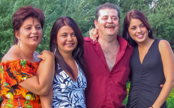 Paul & Coleen (Goyetche) Boudreau of Petit de Grat, NS with daughters Amy & Adelle (2006)